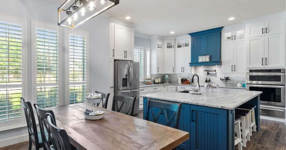 Transitional kitchen remodel with white perimeter cabinets and blue shaker island by Elite Remodeling, Frisco TX