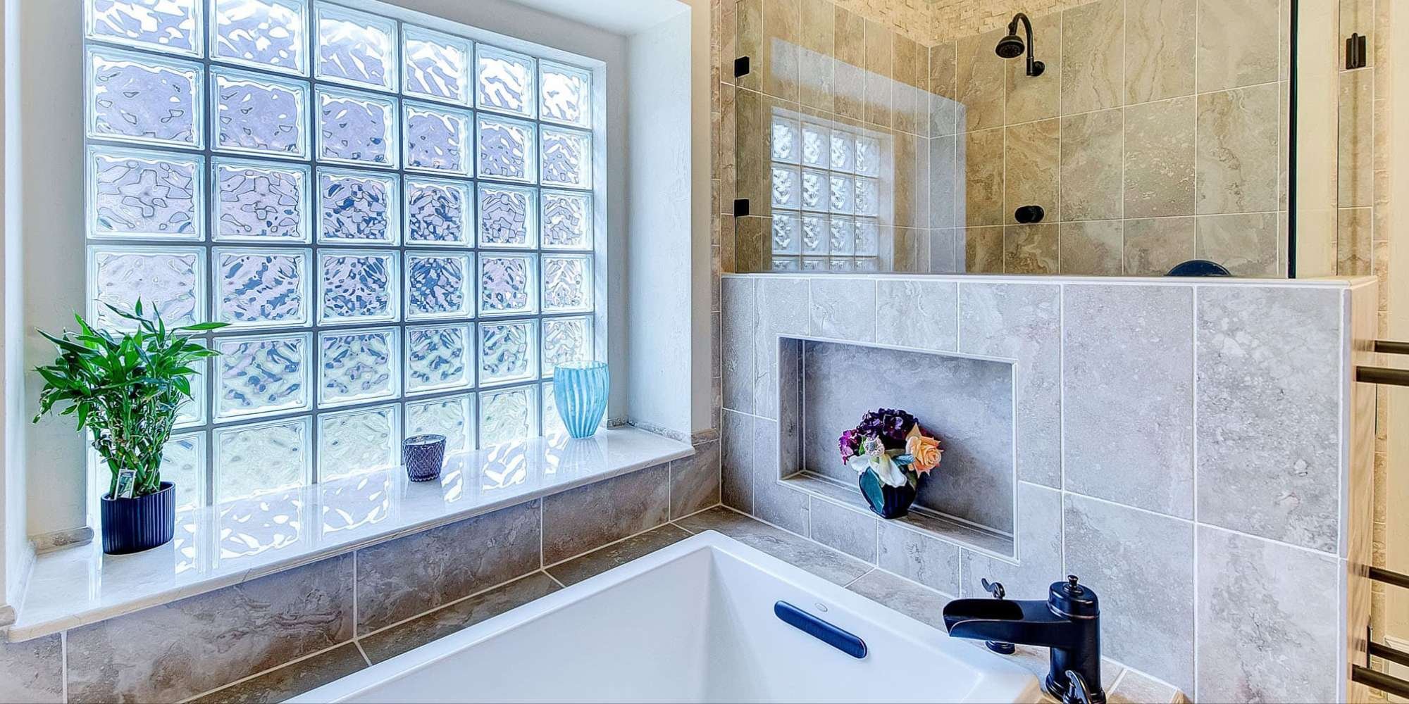 Contemporary bathroom remodel in Frisco with glass block accent window by Elite Remodeling