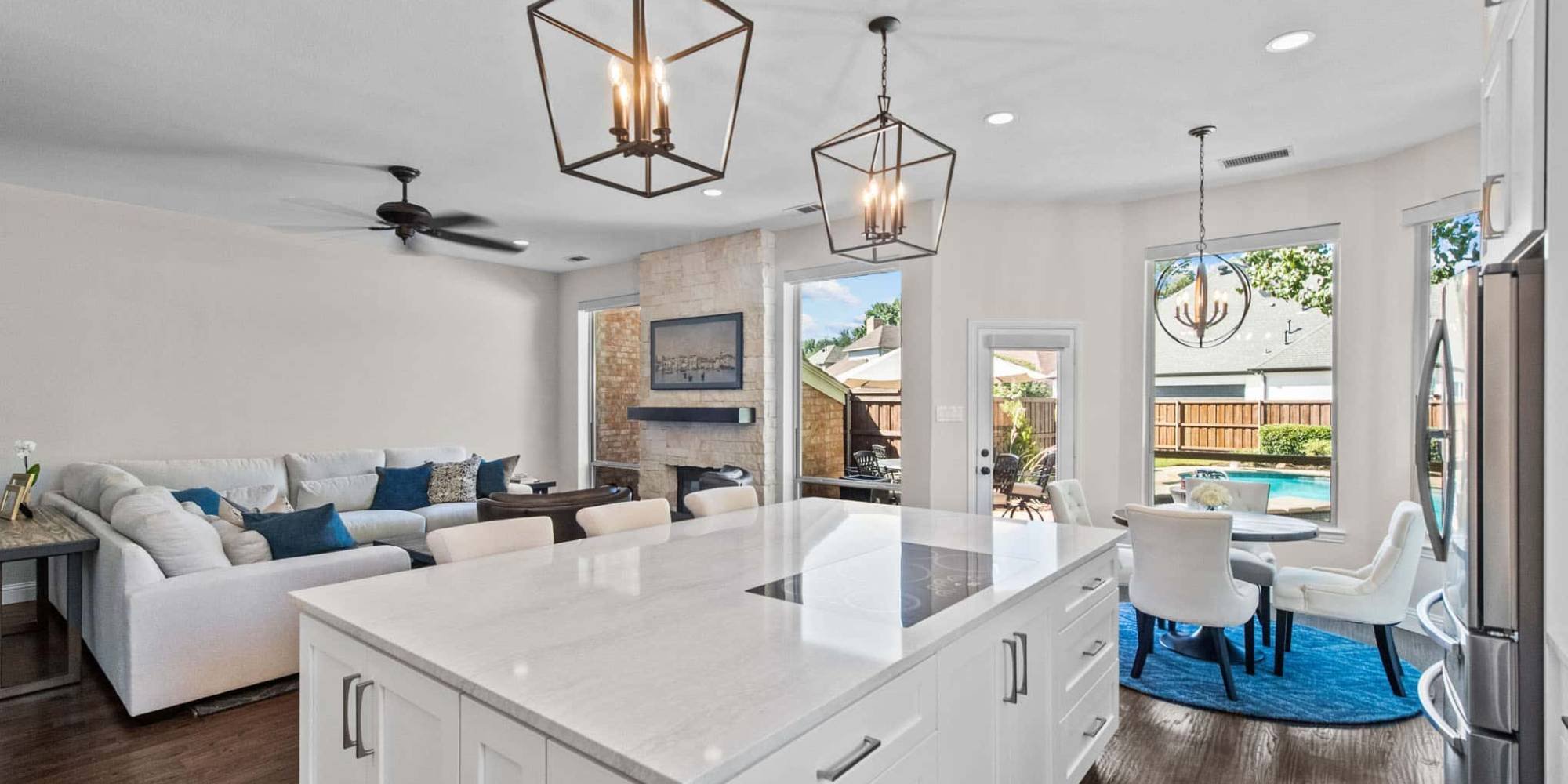 Open-concept kitchen remodel in Frisco, TX with bright natural lighting and modern finishes by Elite Remodeling