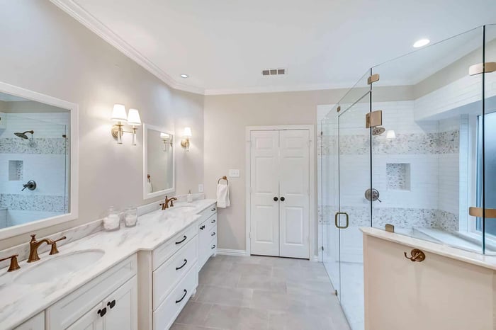Custom remodeled bathroom featuring a large walk-in shower with a bench