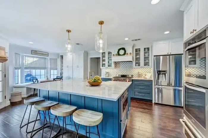 Custom remodeled kitchen in Frisco, TX featuring blue cabinetry and granite countertops
