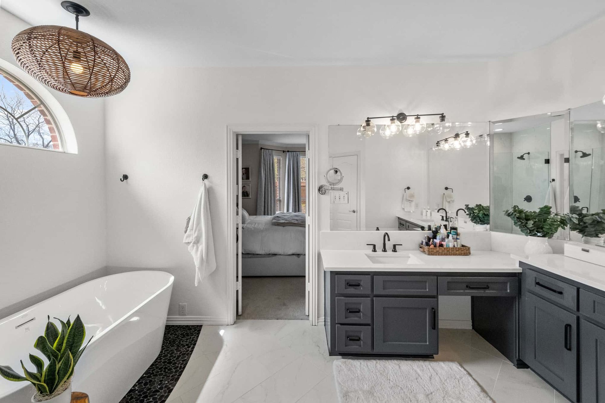 Custom remodeled master bathroom in Frisco, TX featuring a large free-standing bathtub