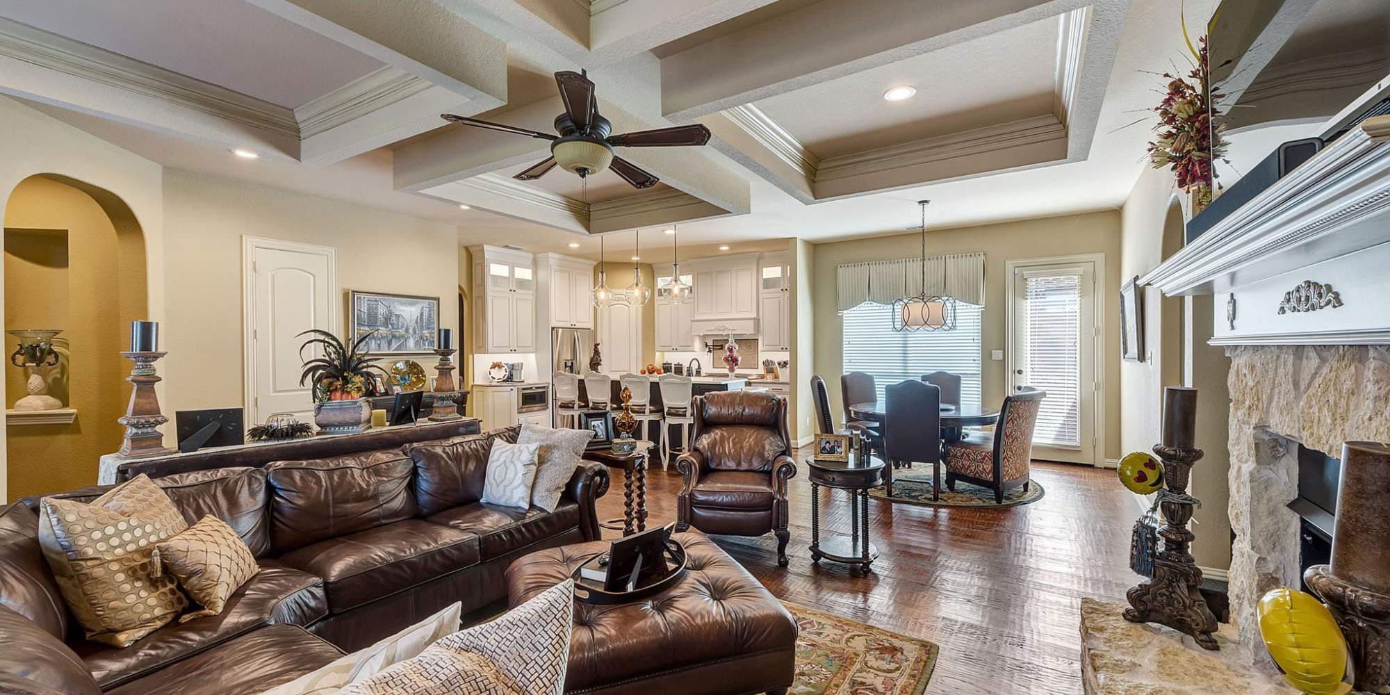 Image of a remodeled living room with open concept kitchen in Plano, TX by Elite Remodeling