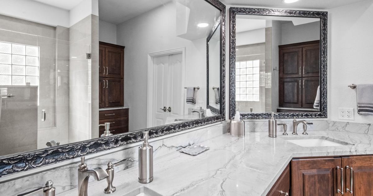 Elite Remodeling bathroom remodel with dual vanity and marble countertops