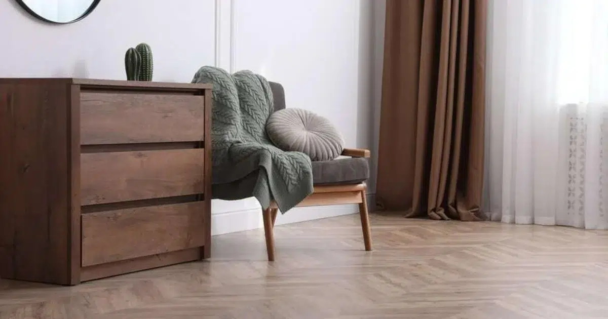 Frisco home remodel with cozy seating rich wood tones and chevron flooring