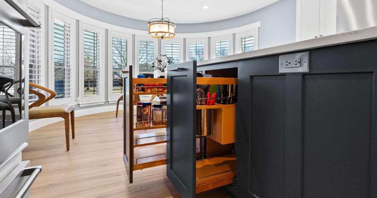 Frisco kitchen remodel with custom cabinet storage and sleek dark island