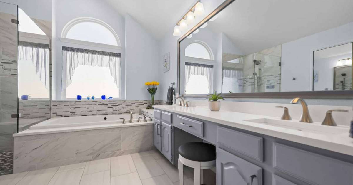 Bathroom remodel with double vanity soaking tub and glass shower
