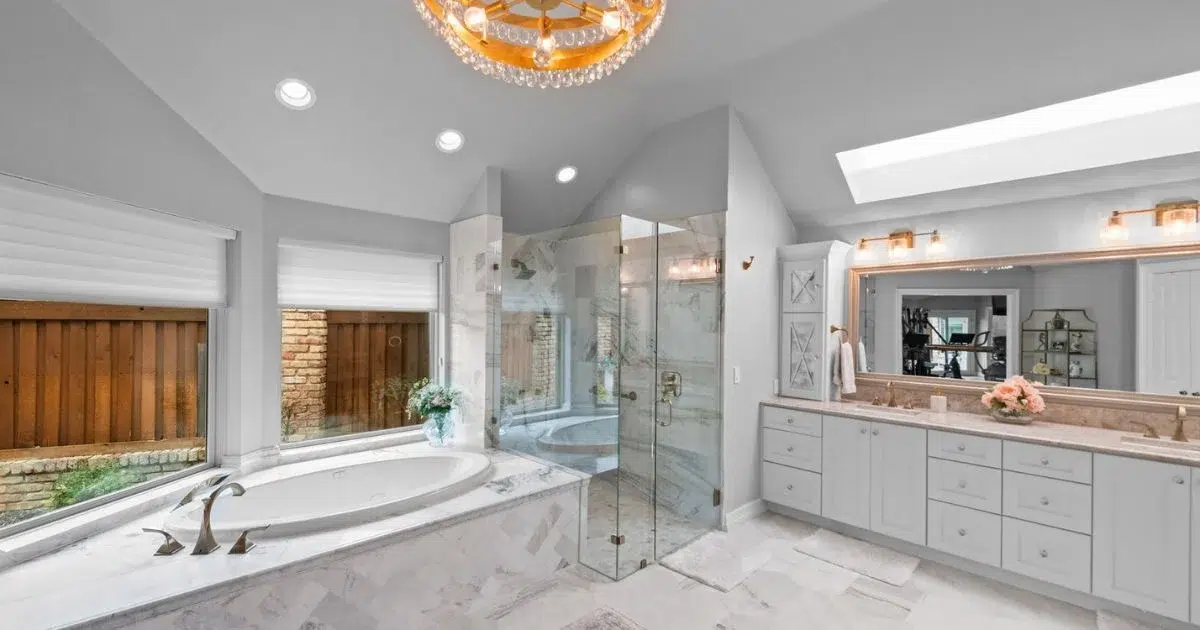 Stylish Frisco bathroom design with double vanity and enclosed shower